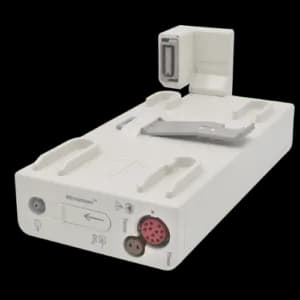 A white medical monitor module with multiple connectors and ports, an attached handle, and a silver clip on top. It has various symbols and labels on its body, indicating its functions and connections.